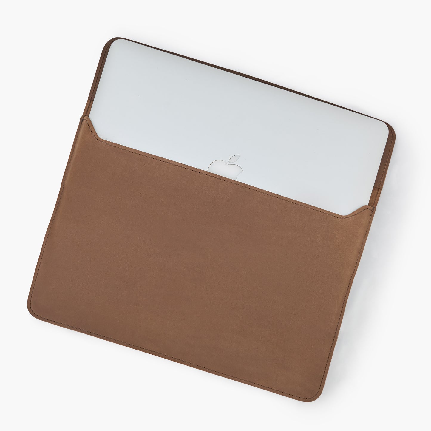 Dark chocolate Crazy Horse leather MacBook sleeve with partially inserted silver MacBook