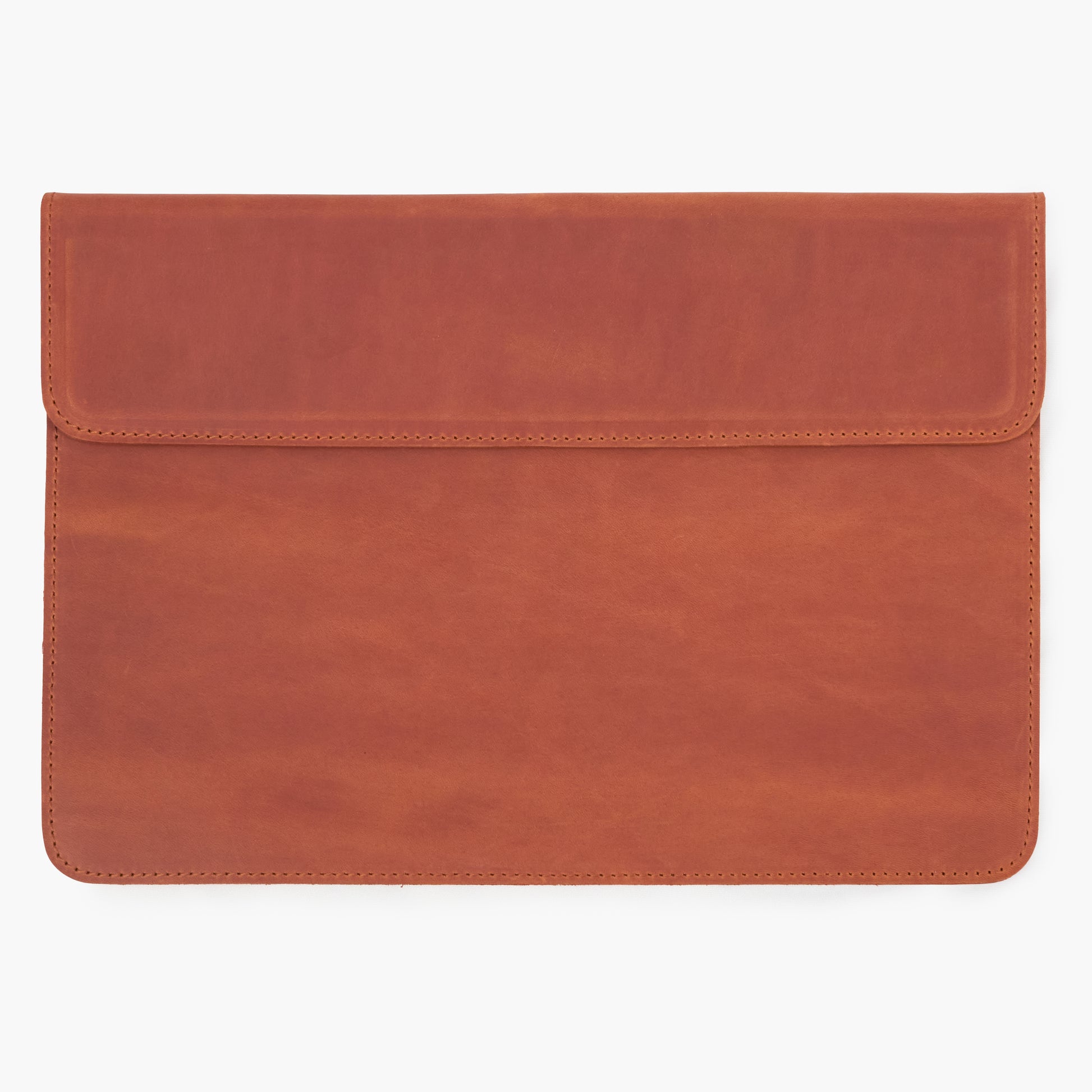Cognac Crazy Horse leather MacBook sleeve with magnetic flap, front view